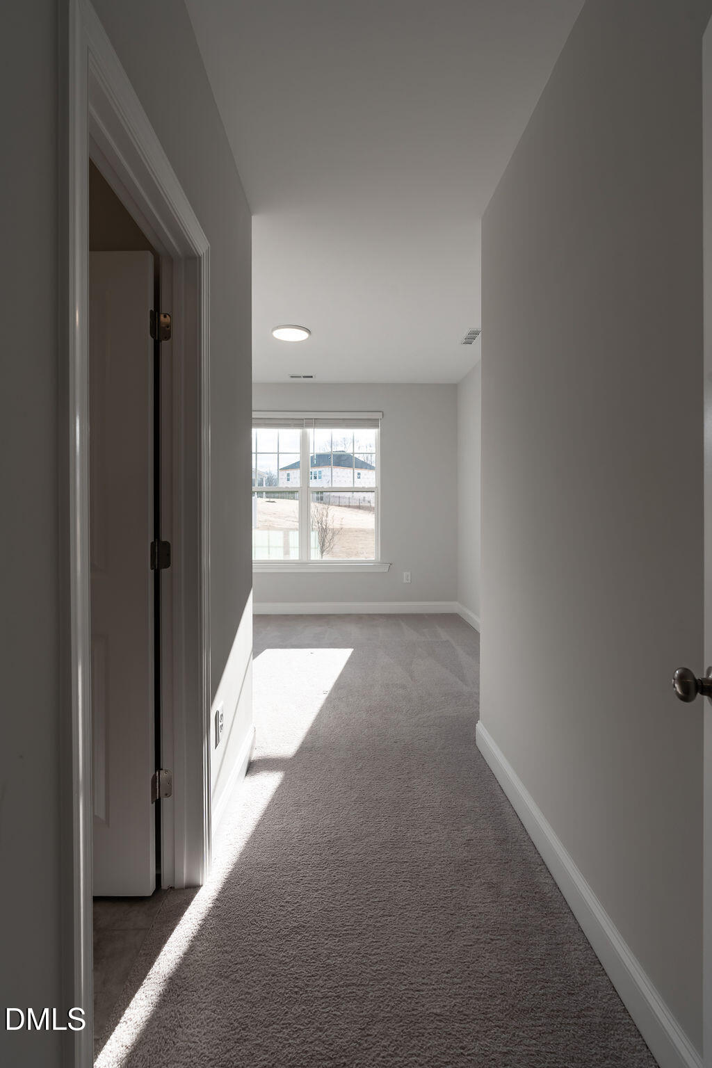 717 Ressler Street Holly Springs, NC 27540 - Photo 13 of 32 a view of an empty room and a window