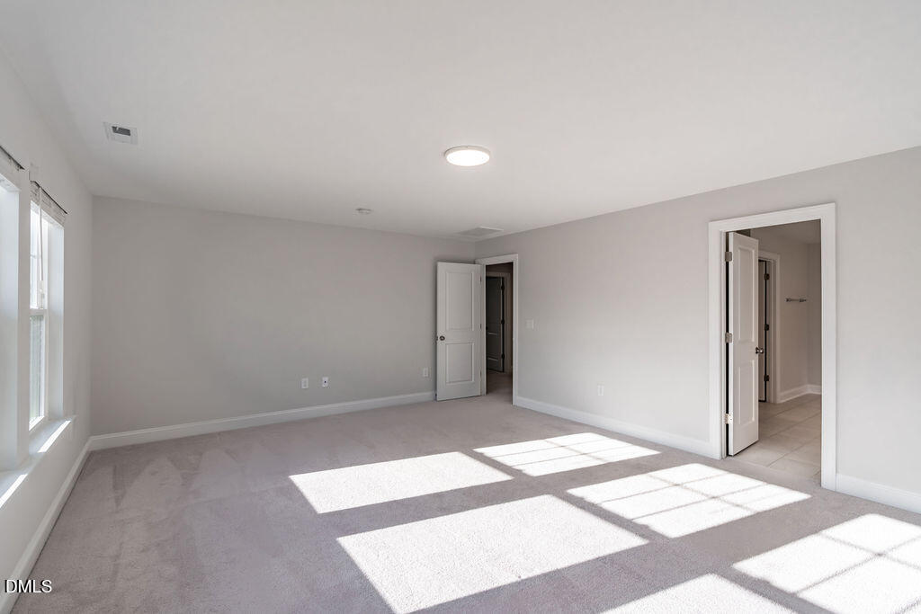 717 Ressler Street Holly Springs, NC 27540 - Photo 17 of 32 a view of an empty room