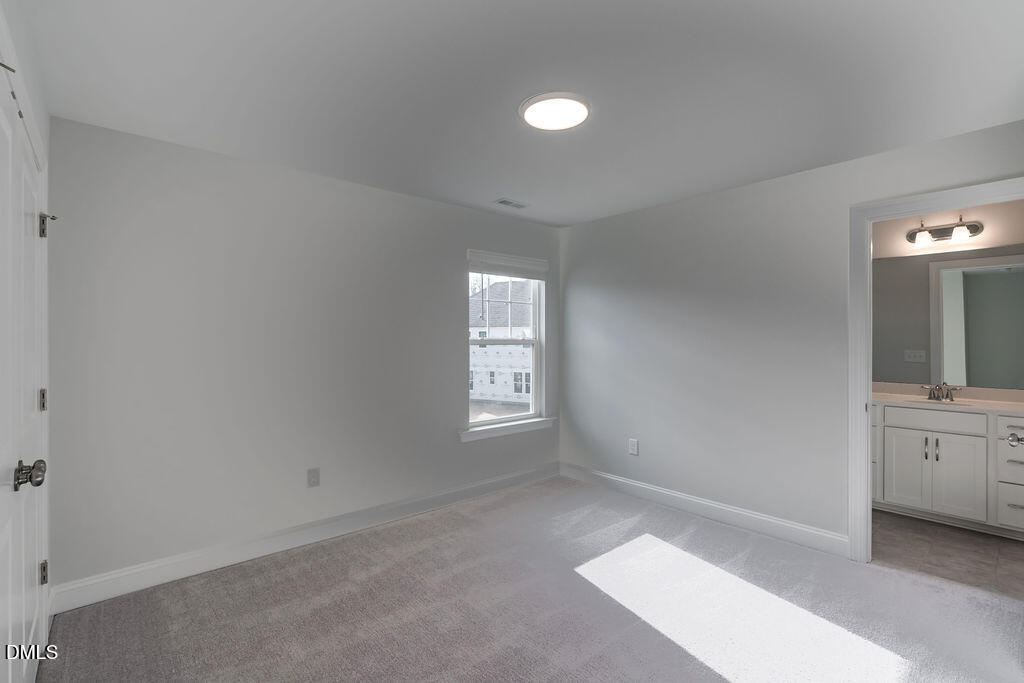 717 Ressler Street Holly Springs, NC 27540 - Photo 28 of 32 a view of an empty room and window
