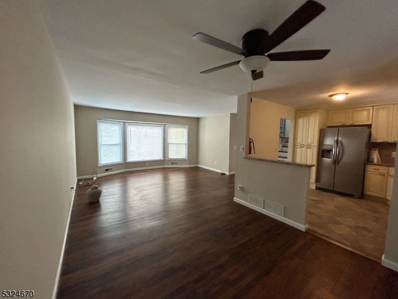 48 Glen Road Bridgewater, NJ 08805 - Photo 14 of 43 a view of empty room with wooden floor and fan