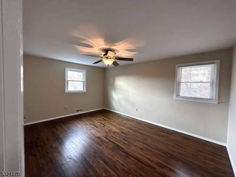 48 Glen Road Bridgewater, NJ 08805 - Photo 19 of 43 a view of an empty room with wooden floor and a window