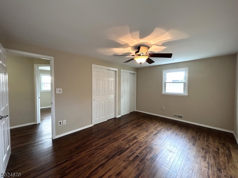 48 Glen Road Bridgewater, NJ 08805 - Photo 20 of 43 a view of an empty room with wooden floor and a window