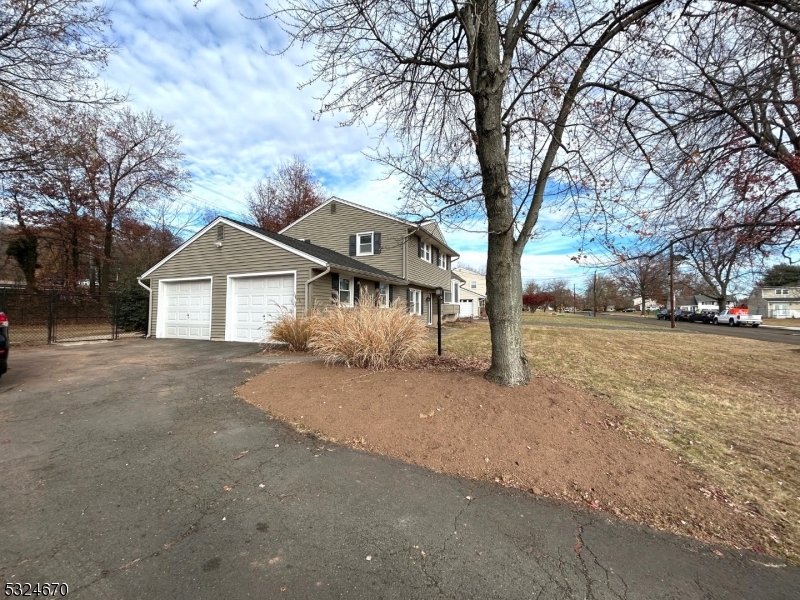 48 Glen Road Bridgewater, NJ 08805 - Photo 2 of 43 a front view of a house with a yard and garage