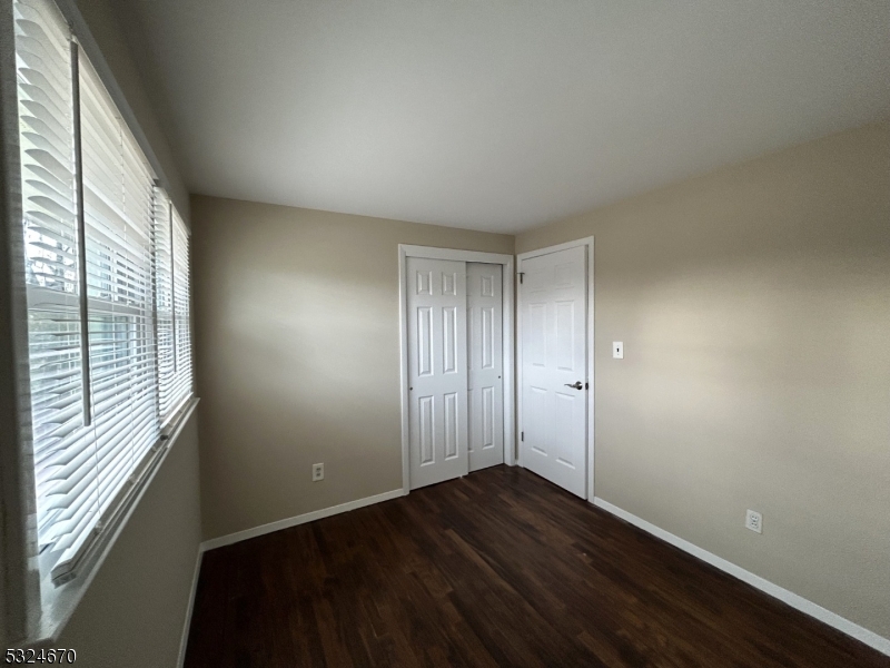 48 Glen Road Bridgewater, NJ 08805 - Photo 26 of 43 an empty room with wooden floor and windows