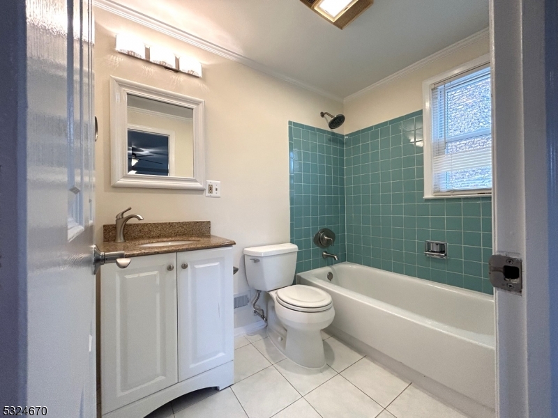 48 Glen Road Bridgewater, NJ 08805 - Photo 29 of 43 a bathroom with a granite countertop toilet a sink and bathtub