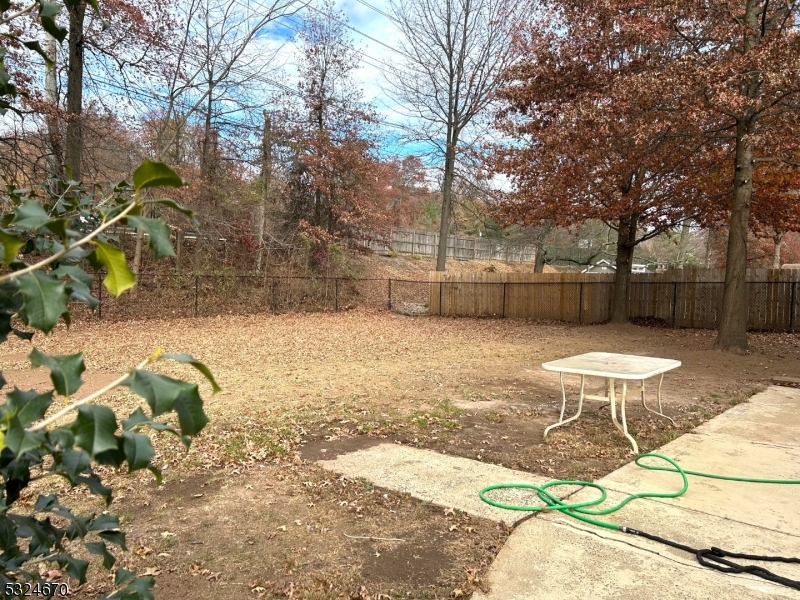 48 Glen Road Bridgewater, NJ 08805 - Photo 38 of 43 a view of a backyard with a table and chairs