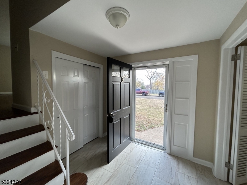 48 Glen Road Bridgewater, NJ 08805 - Photo 4 of 43 a view of a hallway with wooden floor and stairs