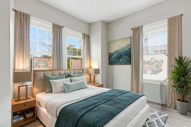 a bedroom with bed and a window