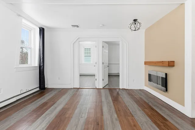 a view of a livingroom with wooden floor