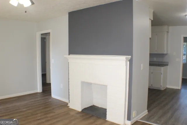 a kitchen with a sink a refrigerator and a stove
