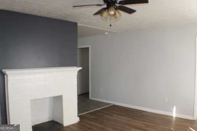a view of hallway with wooden floor