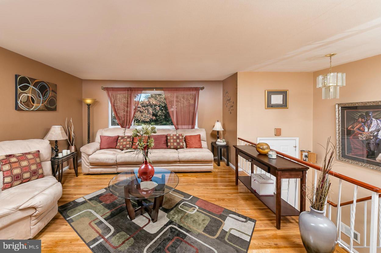 3902 Nemo Road Randallstown, MD 21133 - Photo 11 of 29 a living room with furniture and wooden floor
