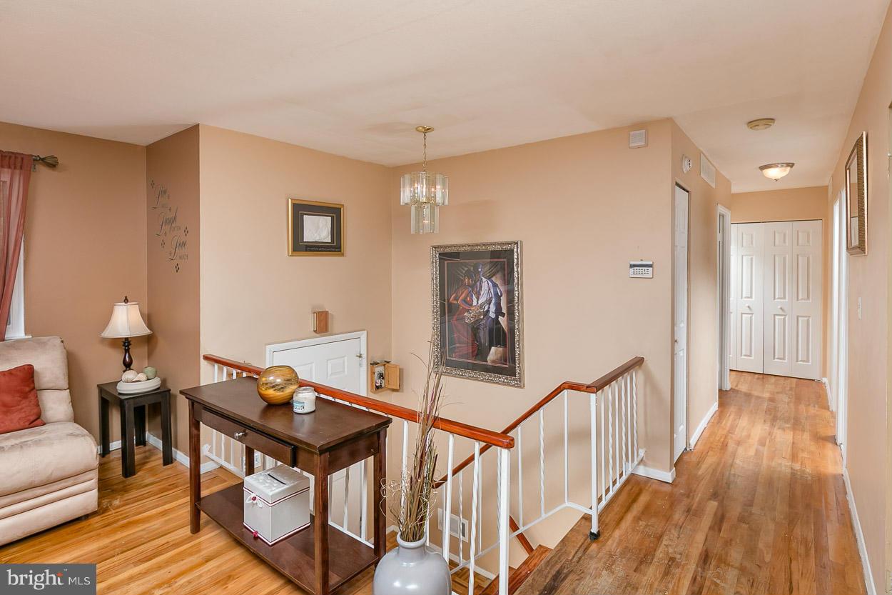 3902 Nemo Road Randallstown, MD 21133 - Photo 13 of 29 a view of a livingroom with furniture and hardwood floor
