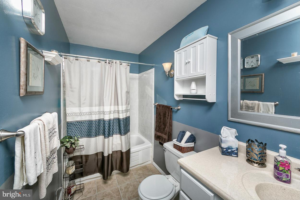 3902 Nemo Road Randallstown, MD 21133 - Photo 17 of 29 a bathroom with a sink toilet and shower