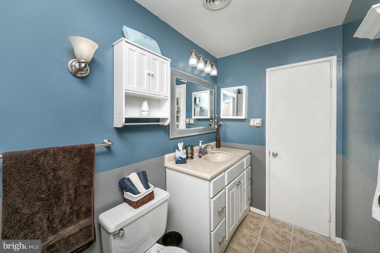 3902 Nemo Road Randallstown, MD 21133 - Photo 18 of 29 a bathroom with a sink vanity and mirror