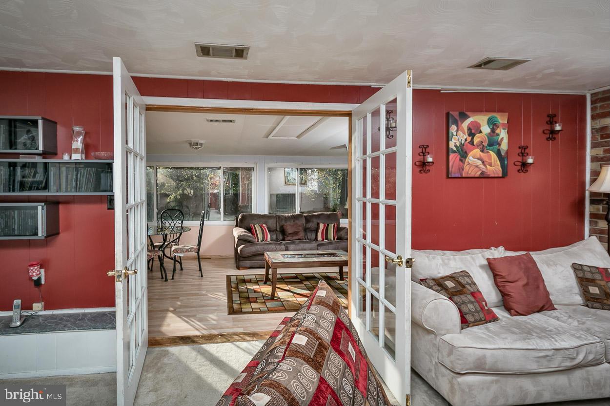 3902 Nemo Road Randallstown, MD 21133 - Photo 20 of 29 a living room with furniture and a floor to ceiling window