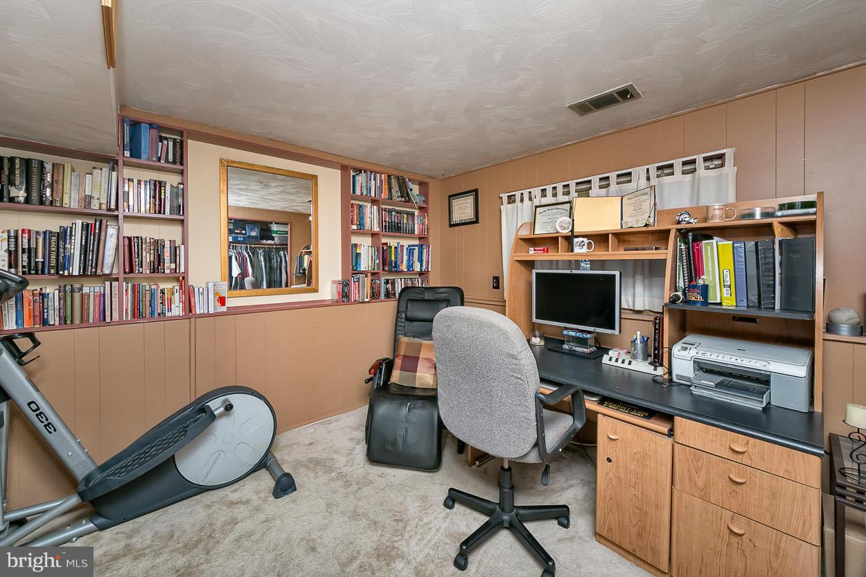 3902 Nemo Road Randallstown, MD 21133 - Photo 22 of 29 a work room with furniture bookshelf and a book shelf