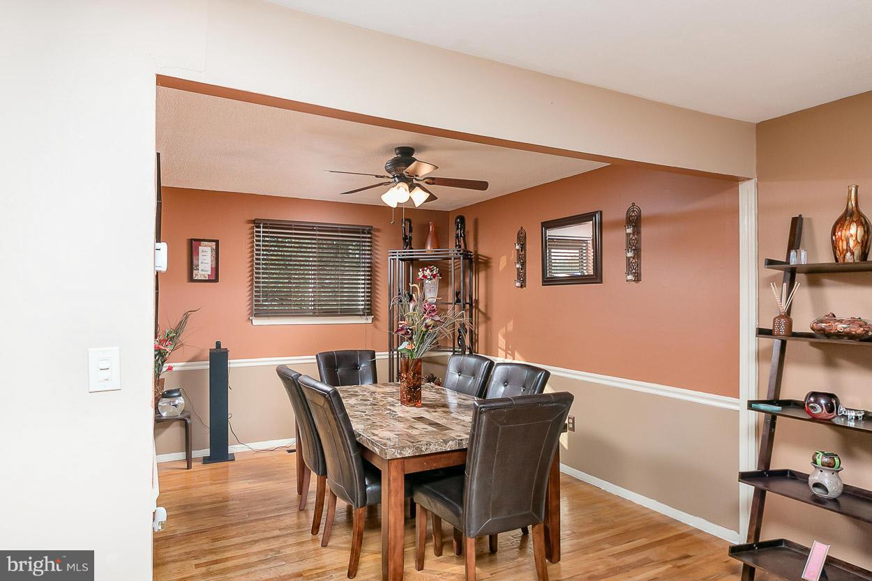 3902 Nemo Road Randallstown, MD 21133 - Photo 8 of 29 a view of a dining room with furniture and wooden floor