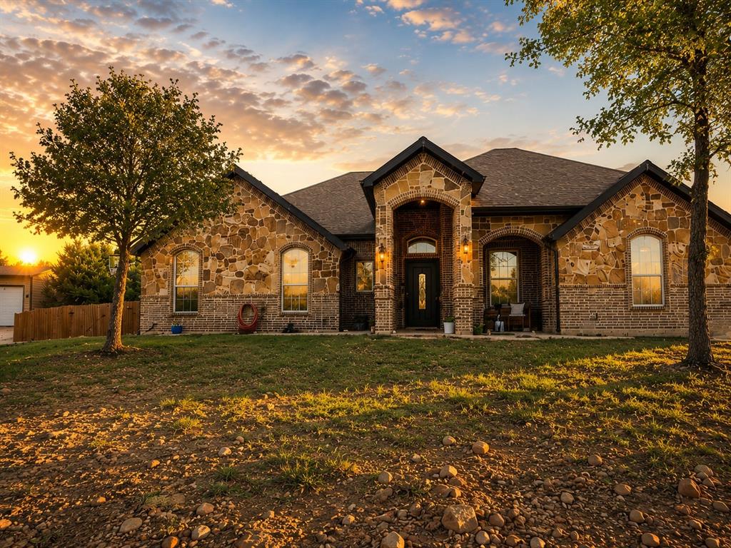 156 Cottongame Road Weatherford, TX 76088 - Photo 1 of 35 Stone and brick facade with a prominent arched entry
