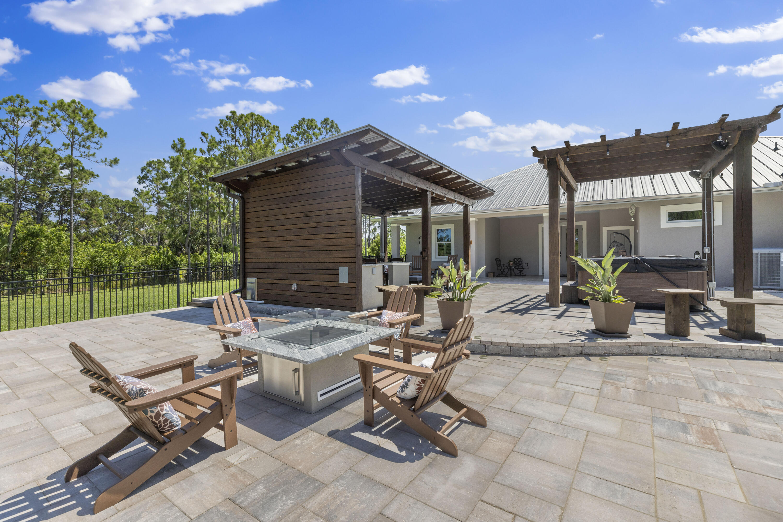 4544 Celestial Drive Grant Valkaria, FL 32949 - Photo 2 of 73 a view of a patio with table and chairs and potted plants