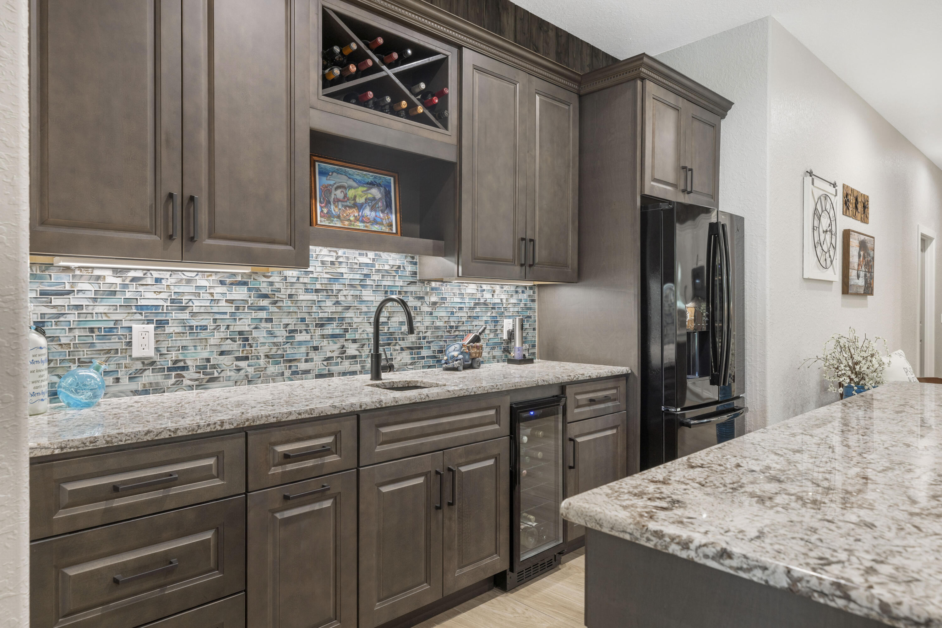 4544 Celestial Drive Grant Valkaria, FL 32949 - Photo 21 of 73 a kitchen with stainless steel appliances granite countertop a sink stove and refrigerator