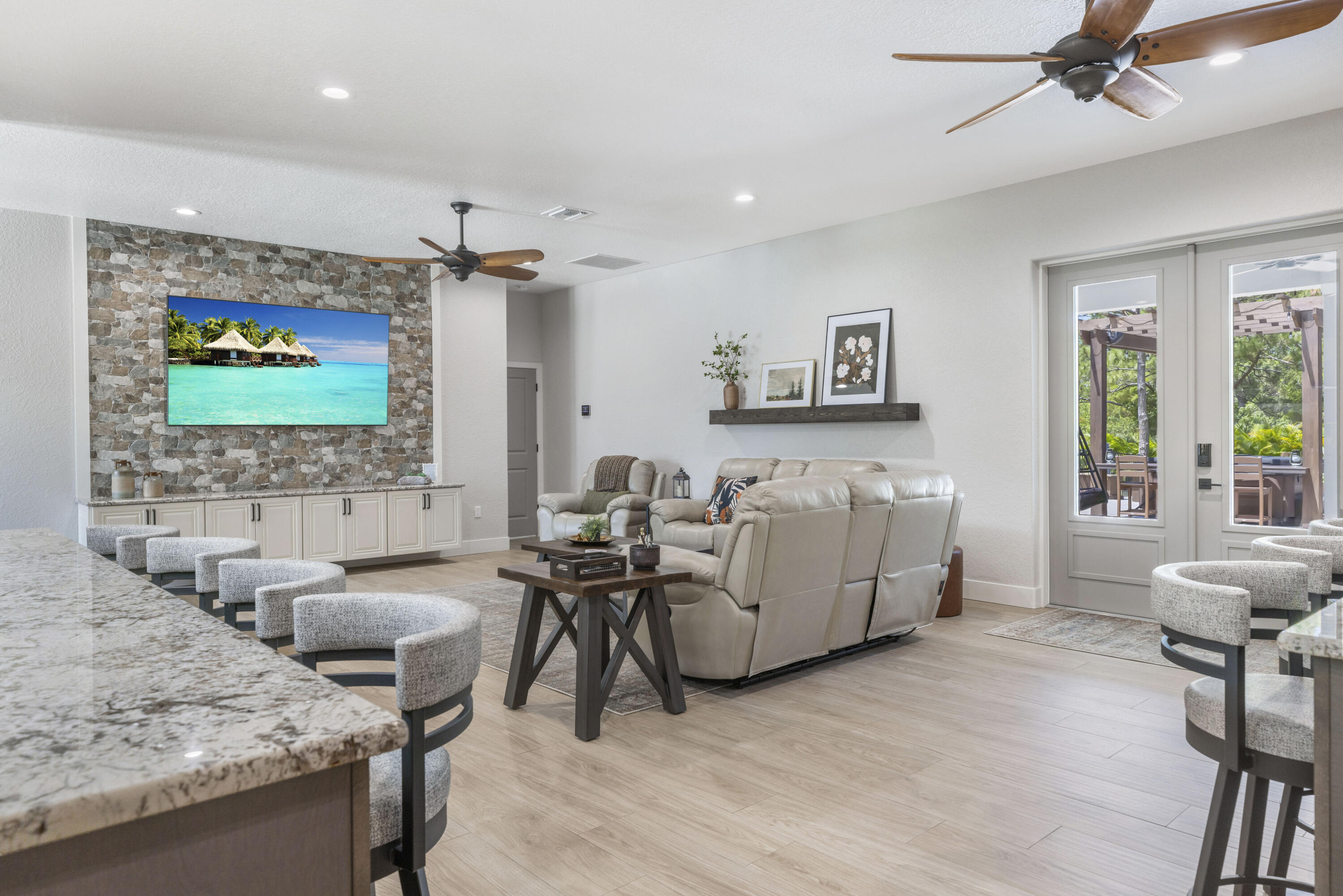 4544 Celestial Drive Grant Valkaria, FL 32949 - Photo 24 of 73 a living room with furniture and a flat screen tv