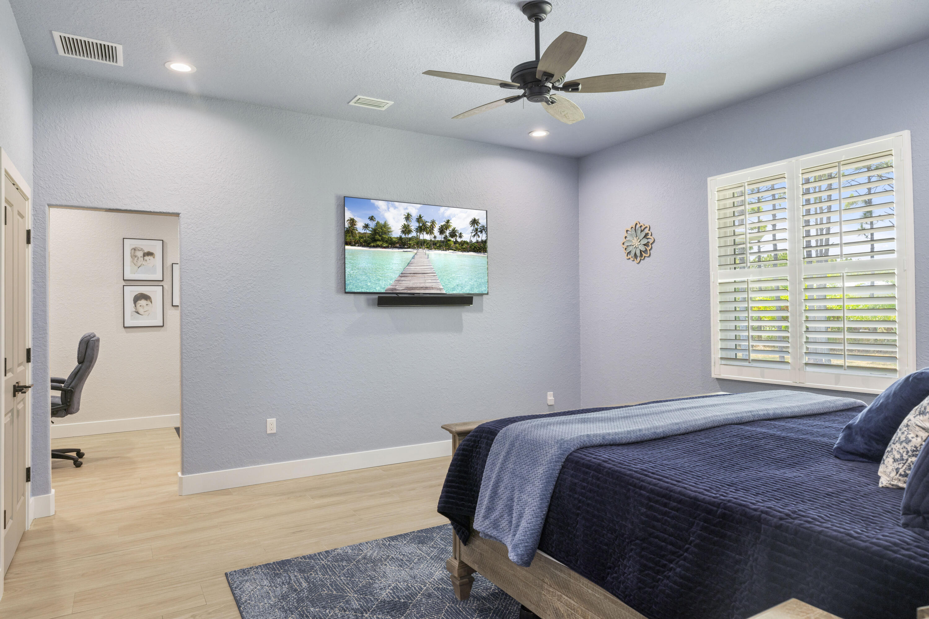 4544 Celestial Drive Grant Valkaria, FL 32949 - Photo 35 of 73 a bedroom with a bed and a painting on the wall