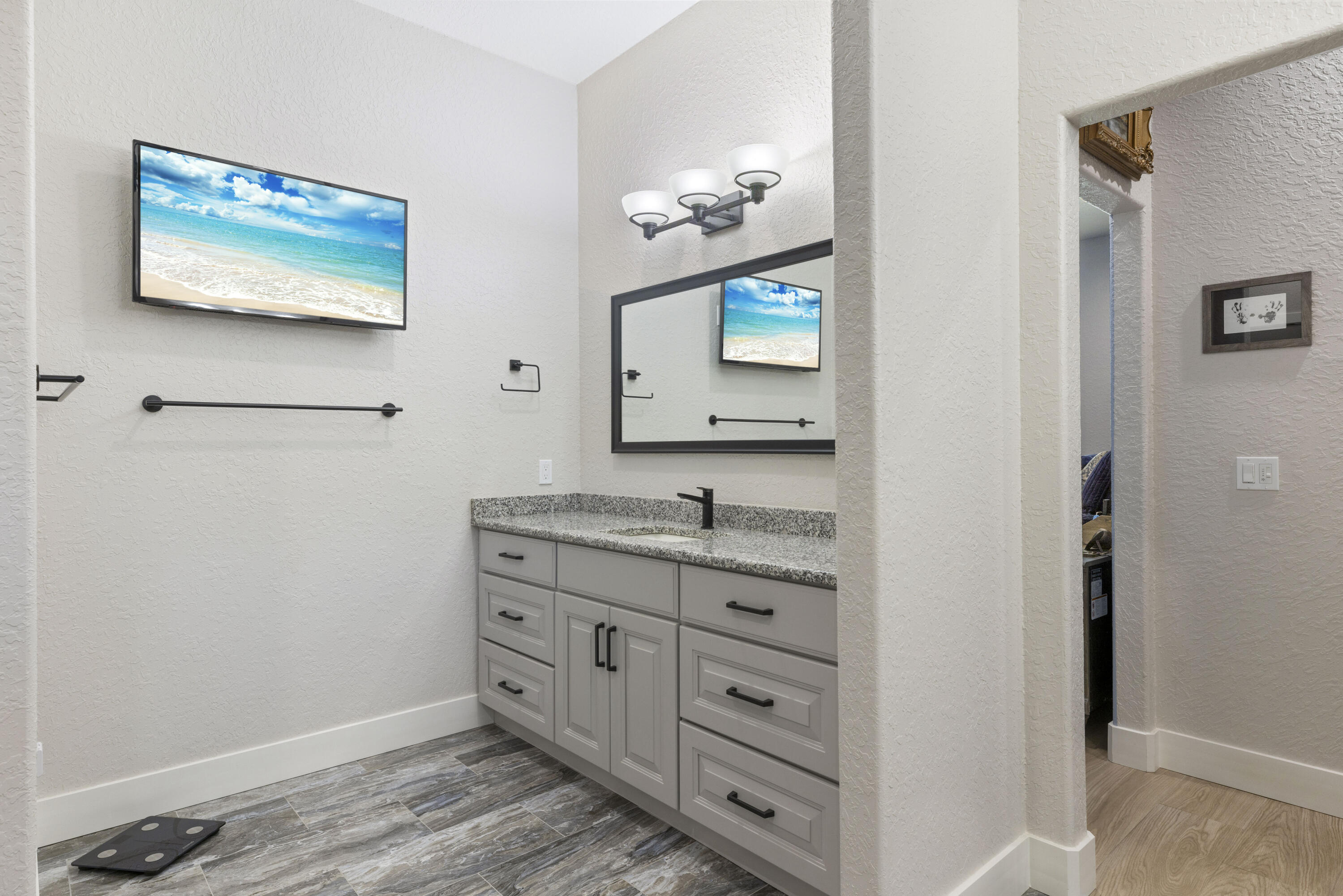 4544 Celestial Drive Grant Valkaria, FL 32949 - Photo 43 of 73 a bathroom with a sink mirror and vanity