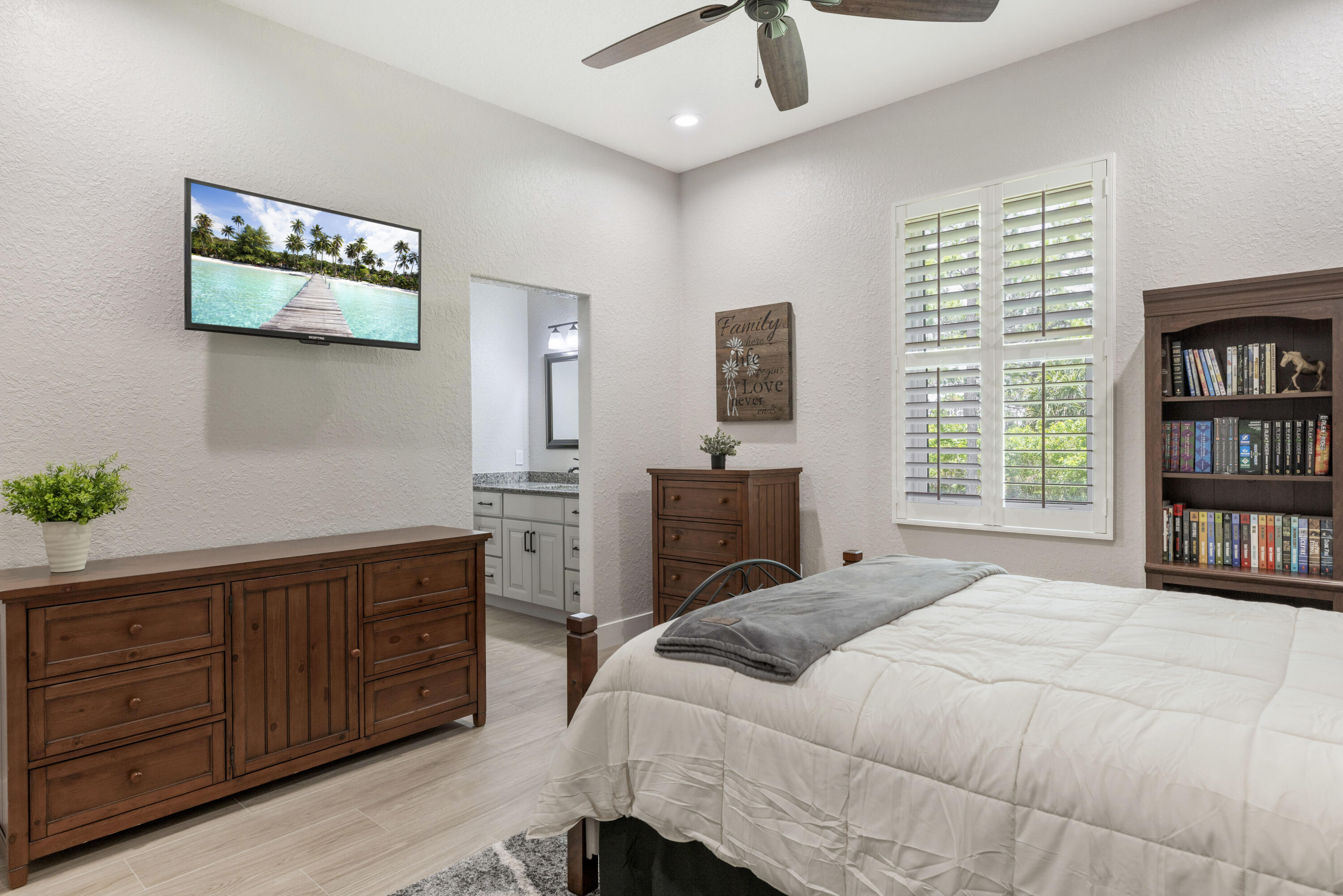 4544 Celestial Drive Grant Valkaria, FL 32949 - Photo 45 of 73 a bedroom with a bed dresser and a window