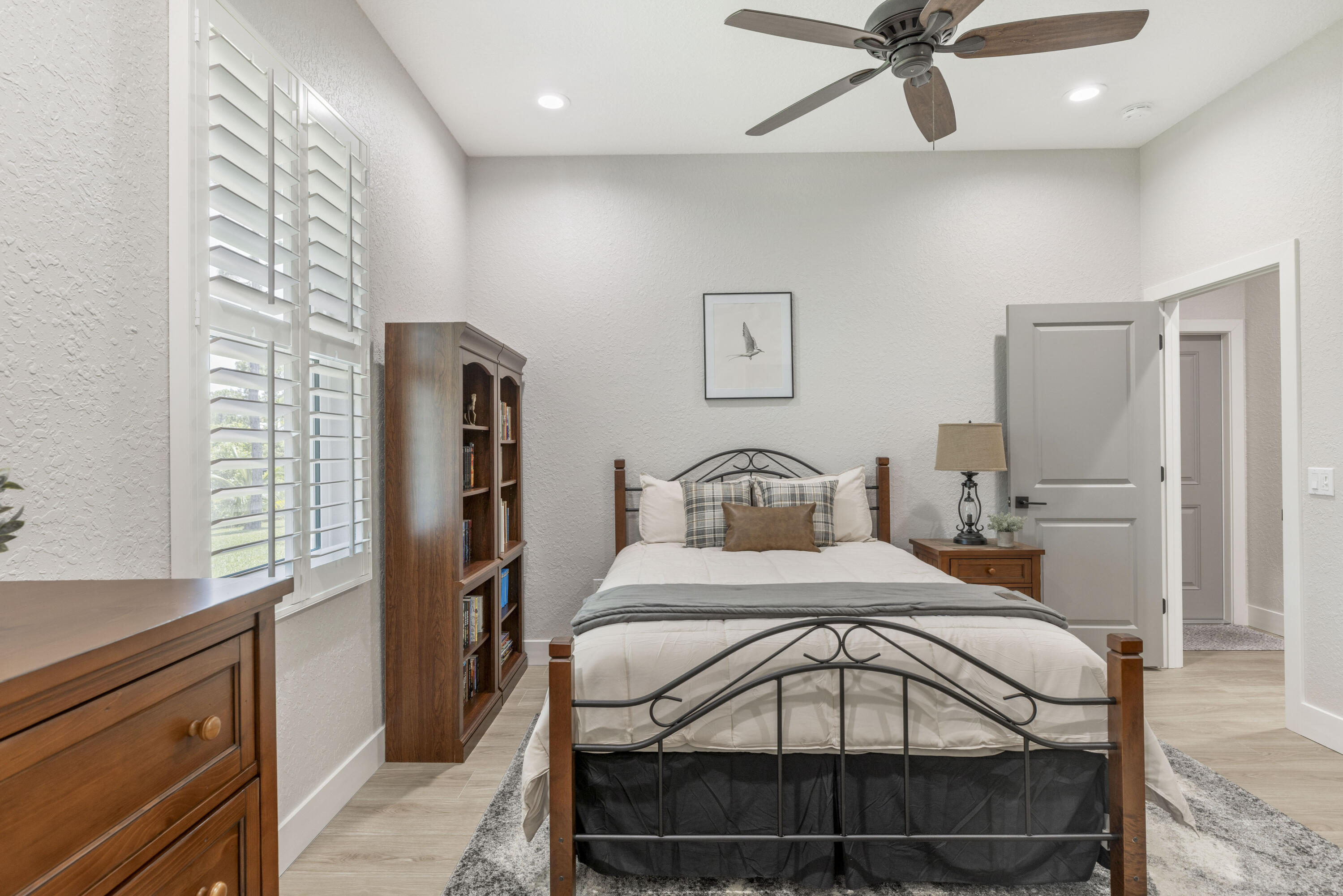 4544 Celestial Drive Grant Valkaria, FL 32949 - Photo 46 of 73 a bedroom with a bed and a chandelier