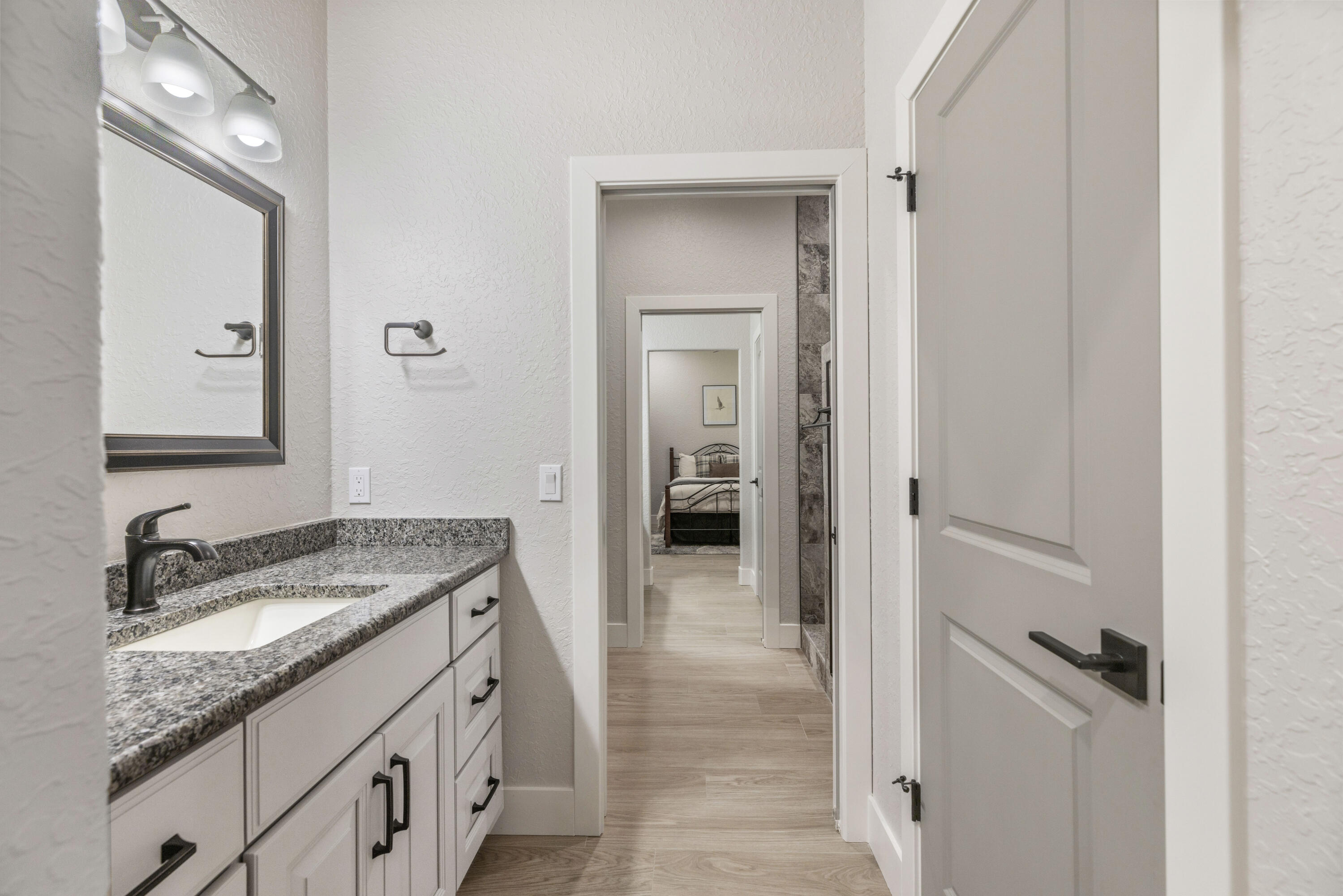 4544 Celestial Drive Grant Valkaria, FL 32949 - Photo 49 of 73 a bathroom with a granite countertop sink and a mirror