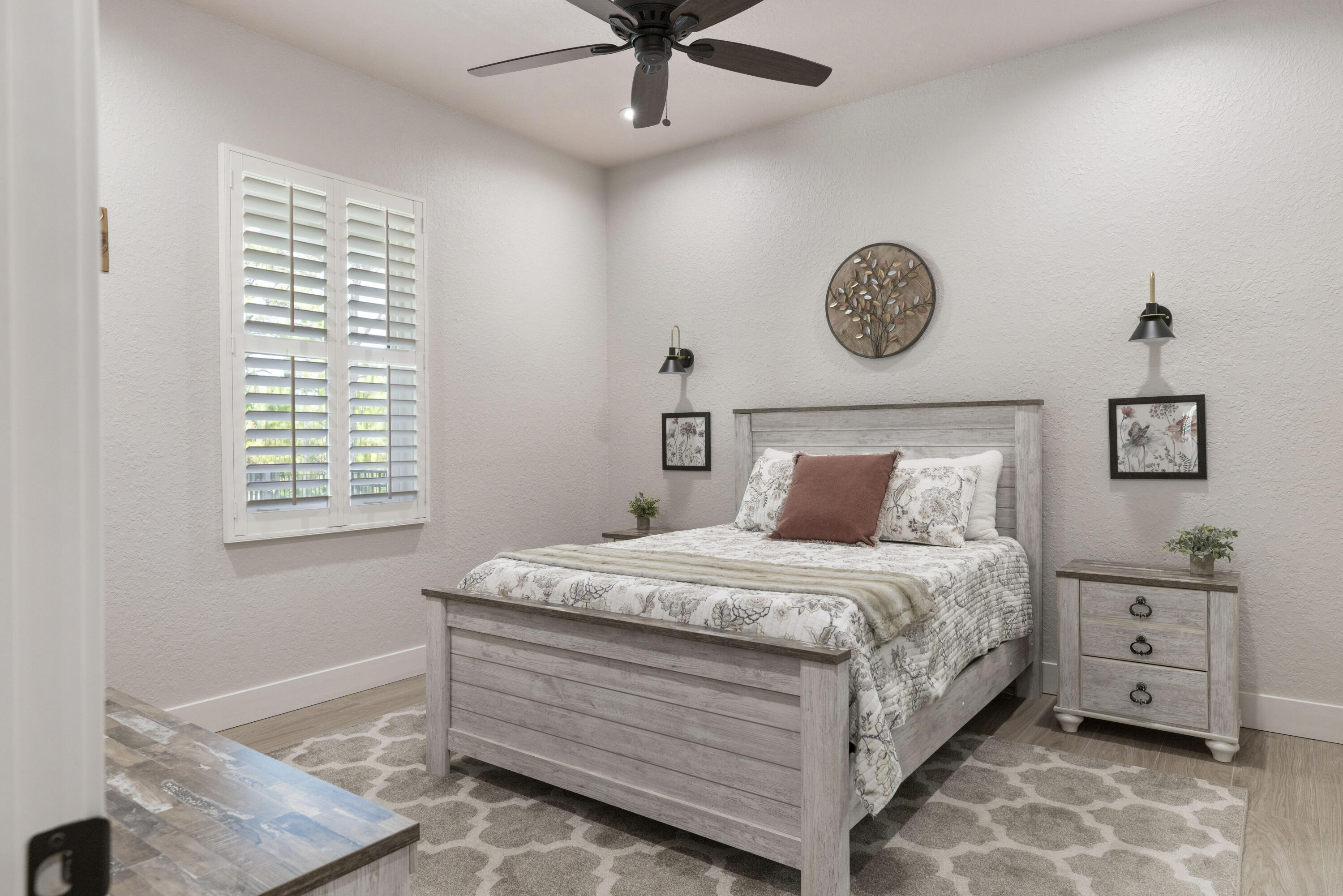 4544 Celestial Drive Grant Valkaria, FL 32949 - Photo 52 of 73 a bedroom with a bed and a chandelier