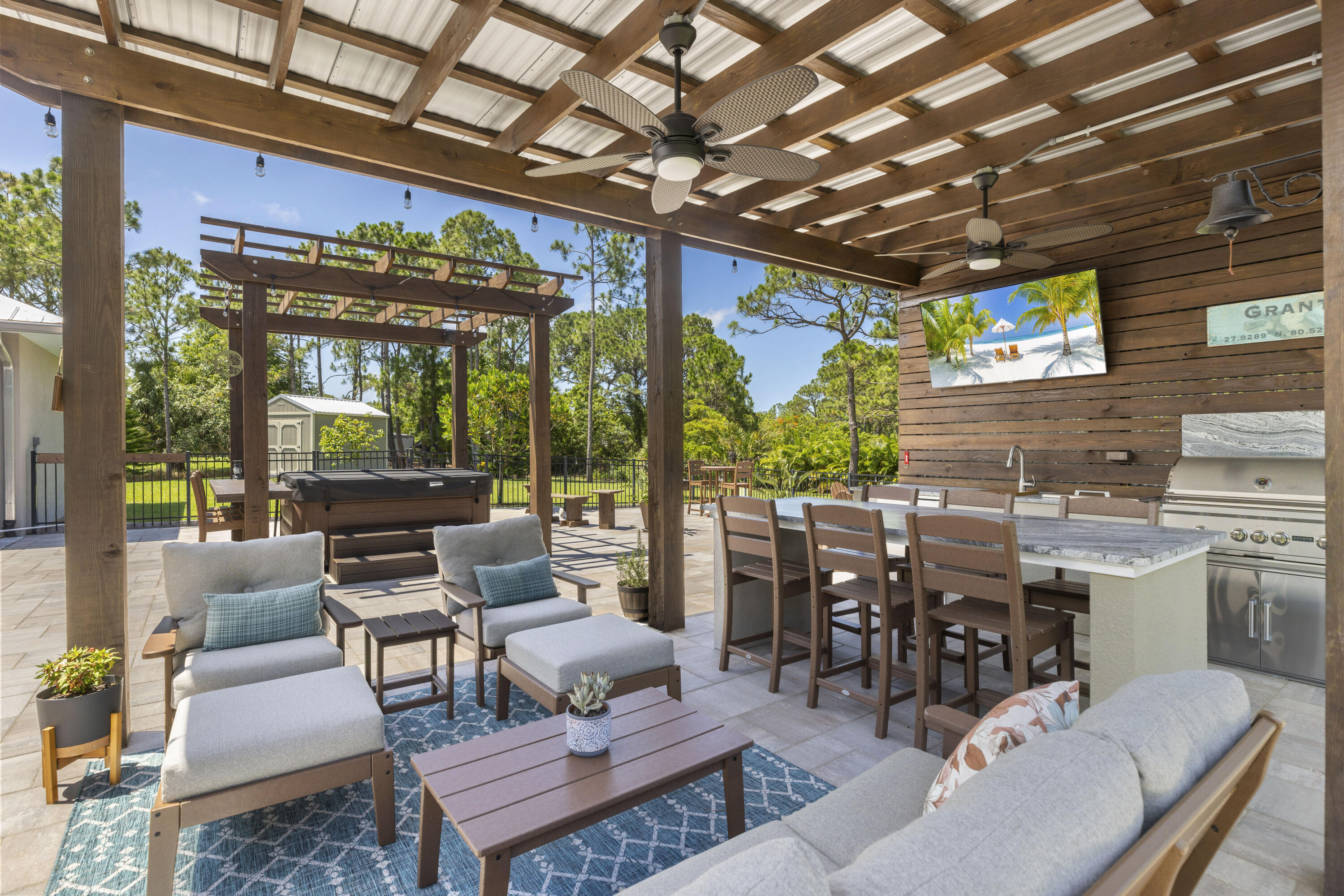 4544 Celestial Drive Grant Valkaria, FL 32949 - Photo 58 of 73 a outdoor living space with patio furniture and garden view