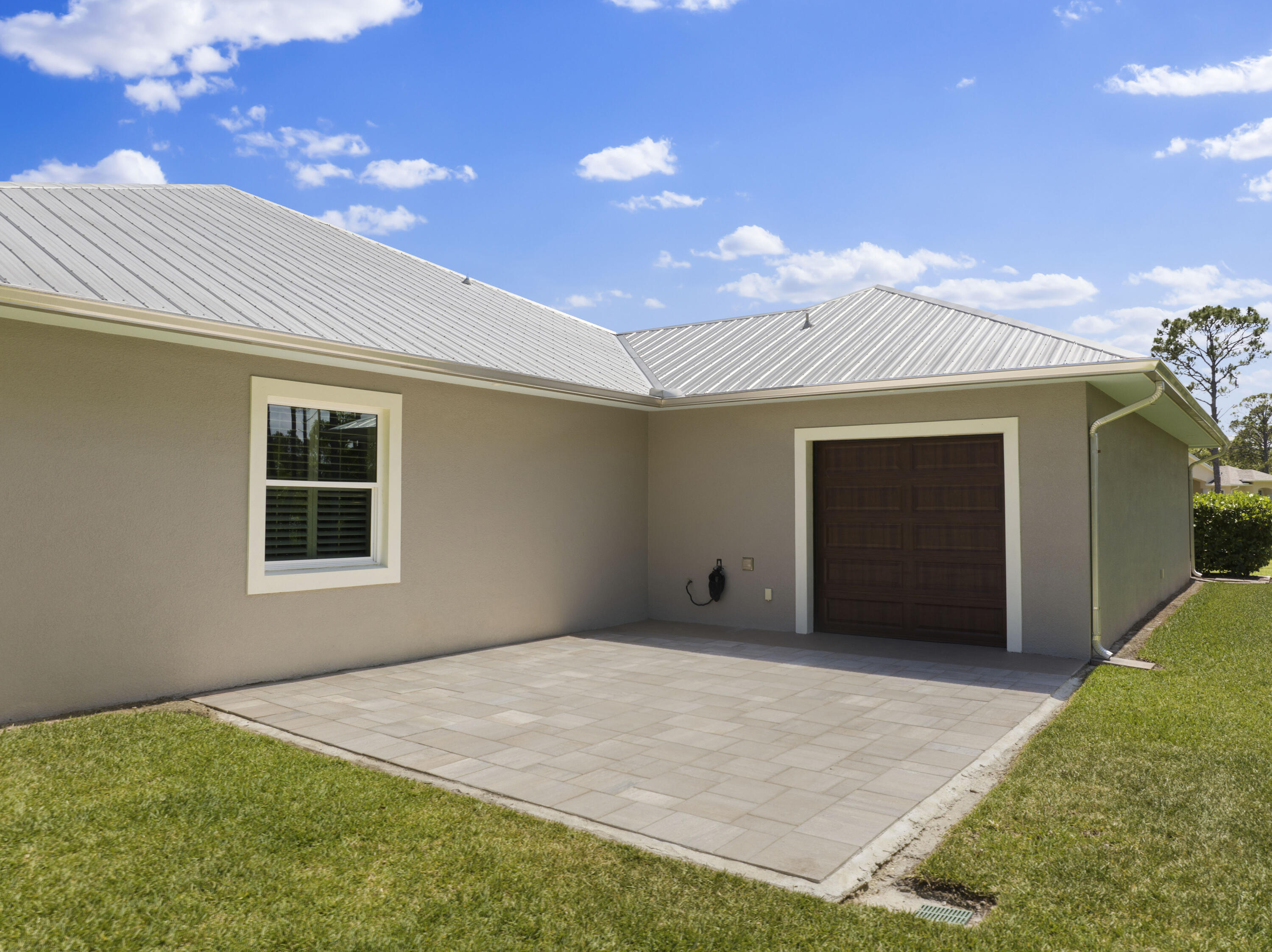 4544 Celestial Drive Grant Valkaria, FL 32949 - Photo 67 of 73 a front view of a house with a yard
