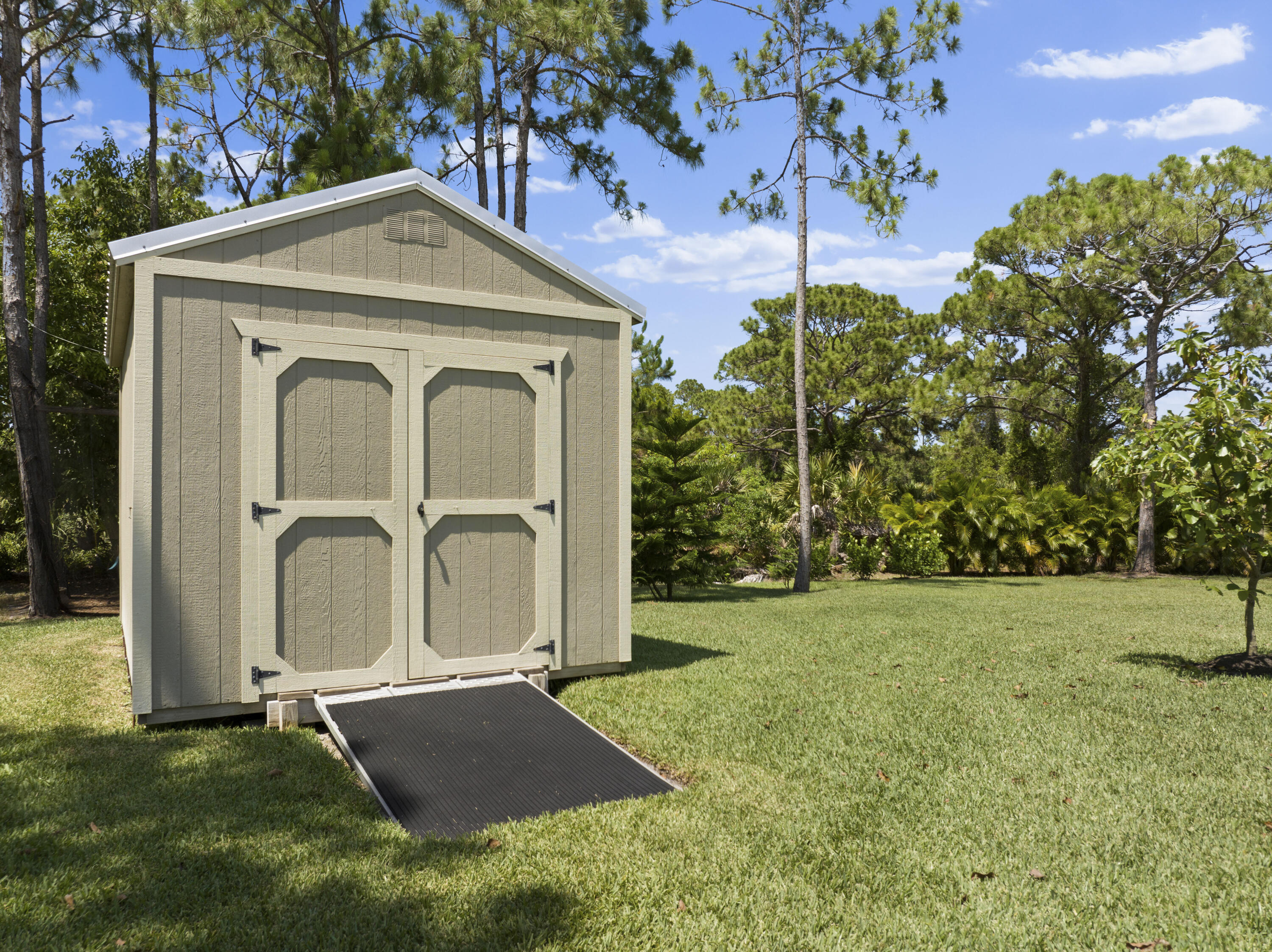 4544 Celestial Drive Grant Valkaria, FL 32949 - Photo 70 of 73 a front view of a house with a yard