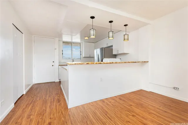 a view of a kitchen from the hallway