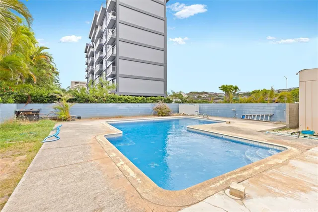 a view of a swimming pool with a lounge chair