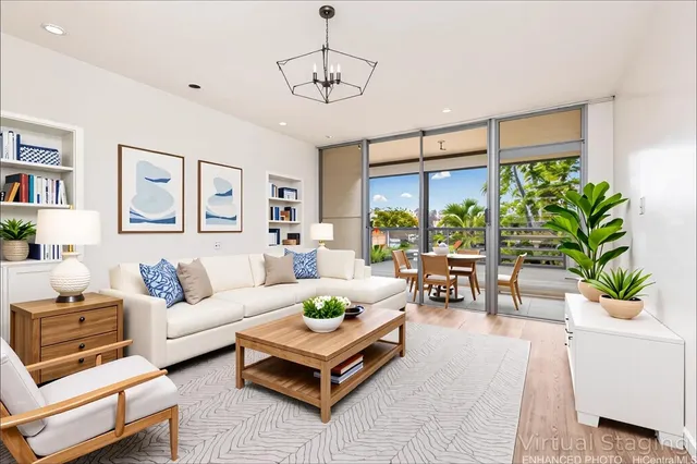 a living room with furniture potted plant and a large window