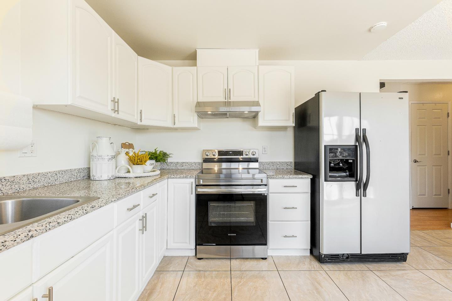 2051 Nunes Drive San Jose, CA 95131 - Photo 16 of 47 a kitchen with a stove and a refrigerator