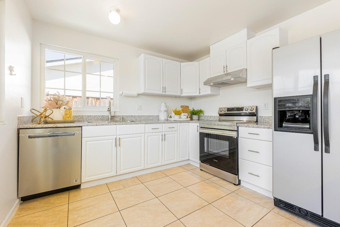 2051 Nunes Drive San Jose, CA 95131 - Photo 18 of 47 a kitchen with cabinets stainless steel appliances and a window