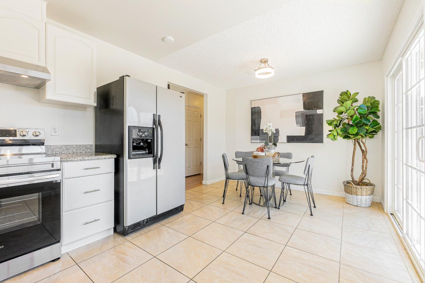 2051 Nunes Drive San Jose, CA 95131 - Photo 19 of 47 a kitchen with stainless steel appliances kitchen island granite countertop a refrigerator and a stove top oven