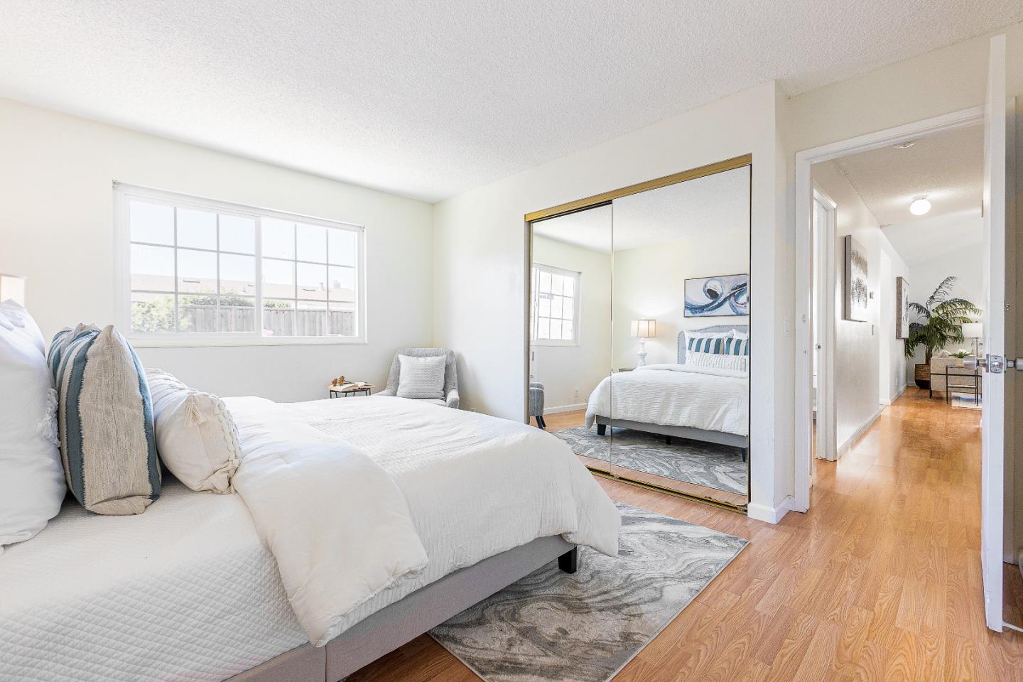 2051 Nunes Drive San Jose, CA 95131 - Photo 21 of 47 a bedroom with a bed and wooden floor