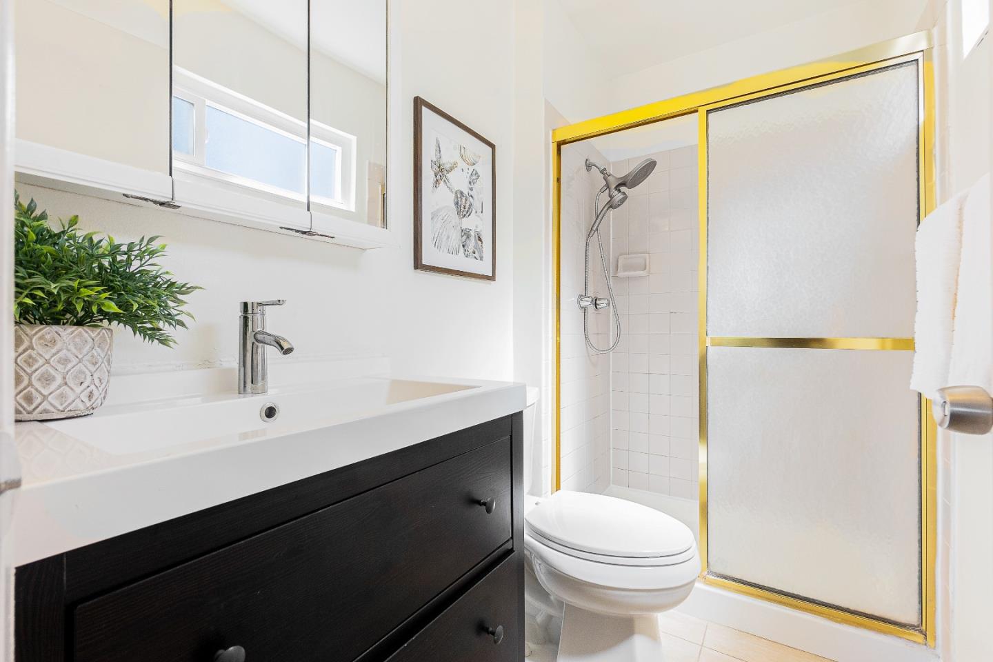 2051 Nunes Drive San Jose, CA 95131 - Photo 22 of 47 a bathroom with a sink a toilet and shower