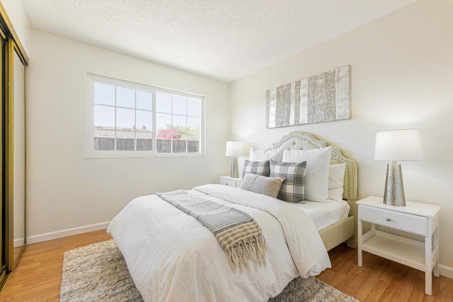 2051 Nunes Drive San Jose, CA 95131 - Photo 25 of 47 a bedroom with a bed and a window