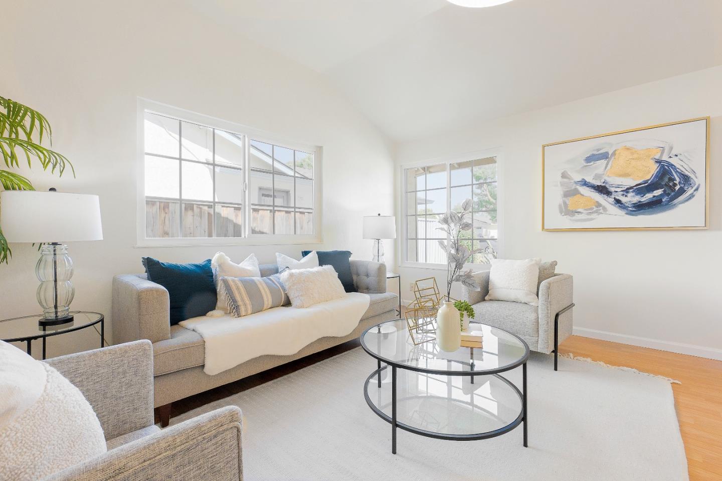 2051 Nunes Drive San Jose, CA 95131 - Photo 7 of 47 a living room with furniture a table and a painting next to a window
