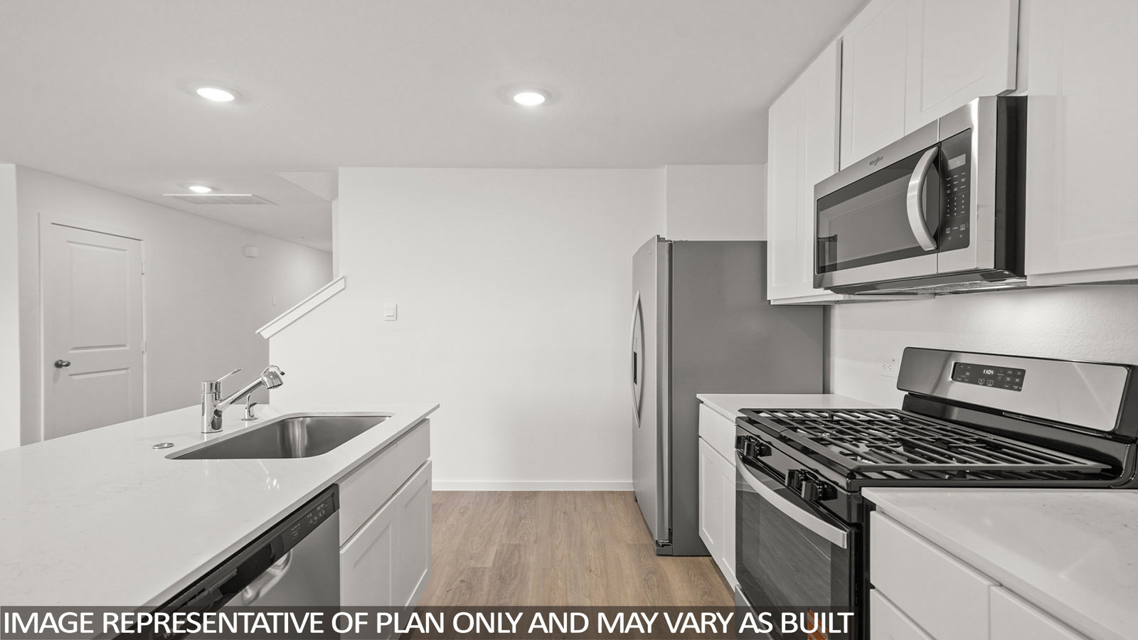 116 Baby Calf Roping Road Jarrell, TX 76537 - Photo 5 of 23 A well-lit kitchen with sleek stainless steel appliances and ample counter space for culinary endeavors.
