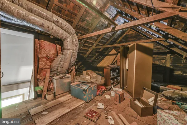 a view of a house with a big yard and a large tree