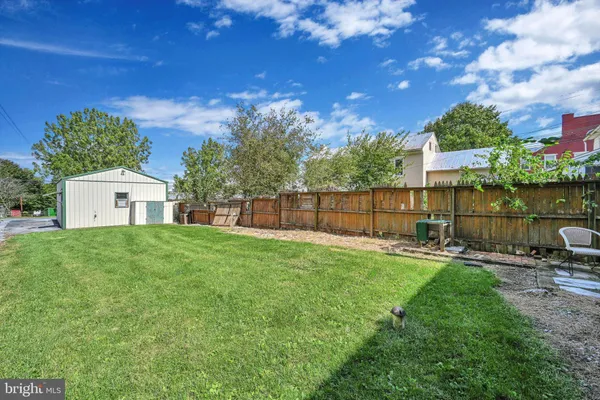 a view of a building with a yard