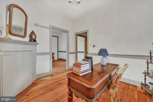 a kitchen with stainless steel appliances granite countertop a sink dishwasher and cabinets with wooden floor