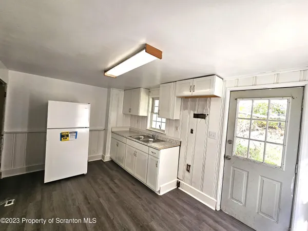 a kitchen with a stove a refrigerator and a stove